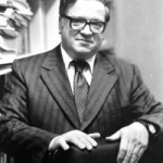 REXINE, John Efstratios